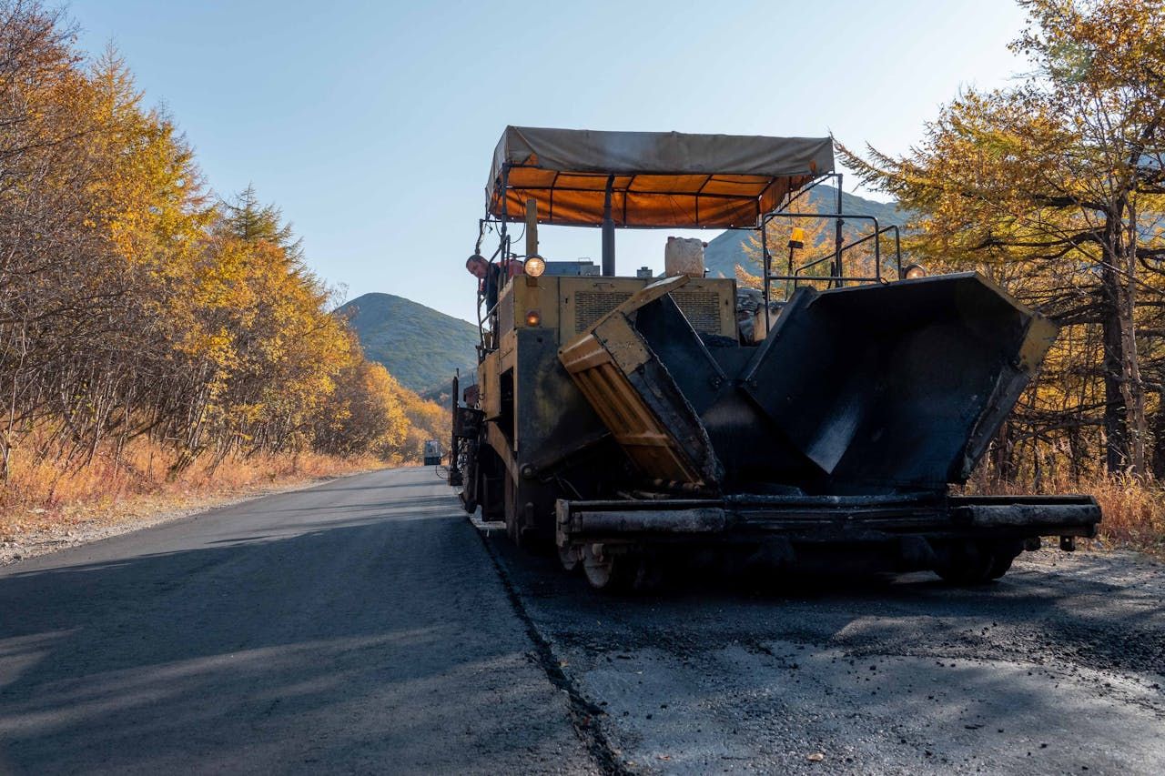 Asphalt repair work fixing cracks and potholes